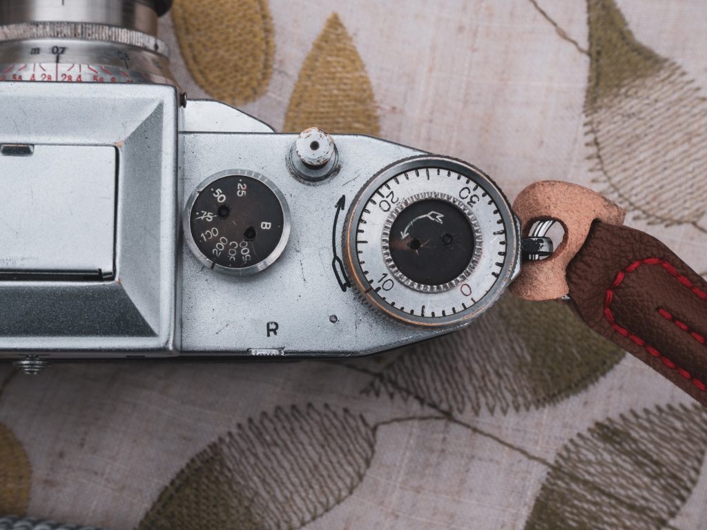 Praktiflex camera from above detailing the shutter speed dial and film advance knob.